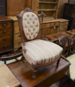 A small late Victorian carved walnut sewing chair, with buttoned back and turned legs, width 53cm,