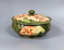 A Moorcroft powder bowl and cover, Hibiscus pattern, 15cm diam.