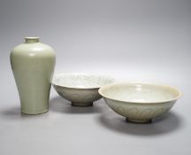 Two Chinese carved celadon dishes, 18cm. diam., and a celadon vase