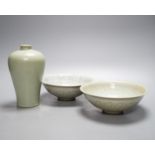 Two Chinese carved celadon dishes, 18cm. diam., and a celadon vase