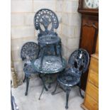 A Victorian style aluminium circular garden table, diameter 60cm, height 62cm and four chairs