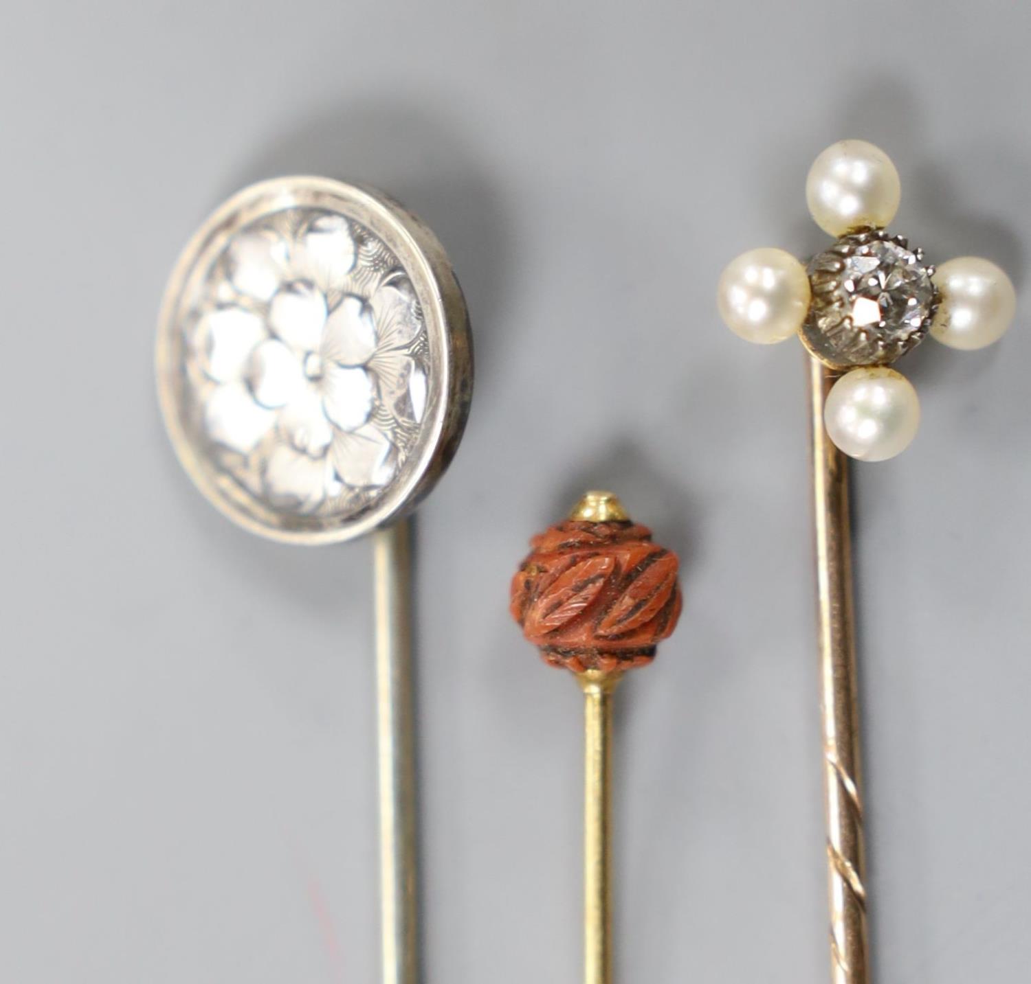 An Edwardian yellow metal, seed pearl and diamond set stick pin, 57mm and two other stick pins. - Image 3 of 5