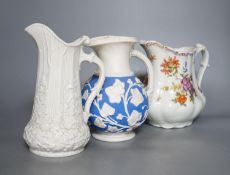 A Samuel Alcock relief-moulded jug, 20cm, and two other jugs