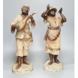 A pair of terracotta musician figures, incised numbers to base, 49cm