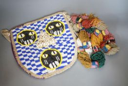 A large African beadwork necklace and three beadwork bags