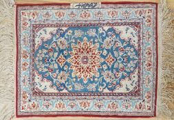 A north-west Persian blue-ground floor mat, signed, 42x53cm