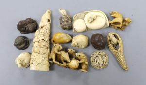 A collection of Japanese ivory and wood netsuke and okimono