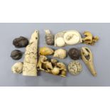 A collection of Japanese ivory and wood netsuke and okimono