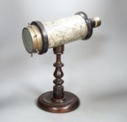 A Victorian kaleidoscope, on original turned wood stand, 39cm