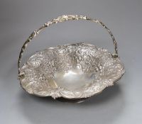 A Victorian Scottish silver fruit basket, embossed with fruit amid scrolls, MS&B, Glasgow, 1861,