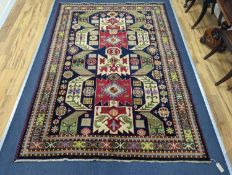 A Caucasian blue ground rug, 240 x 176cm