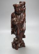 A Chinese hardwood figure of an immortal, 36cm