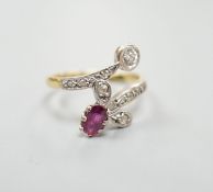 An early to mid 20th century 18ct, ruby and diamond set crossover ring, with diamond set