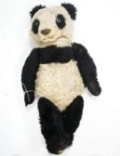A Merrythought Panda 1930's Label Reg. Design, very good condition, slight thinning right side of