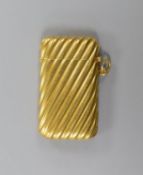 An early 20th century French fluted yellow metal (18ct poincon mark) vesta case, 45mm,gross 13.5