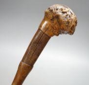 A 19th century folk art walking stick, 89 cms long.