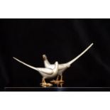 Two 20th century Japanese patinated bronze pheasants with lacquer stand, in original box