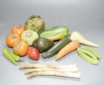 A collection of vintage Penkridge ceramic vegetables including an artichoke, avocado, peppers and