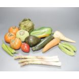 A collection of vintage Penkridge ceramic vegetables including an artichoke, avocado, peppers and