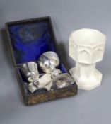 A Victorian Parian baptismal font, 11cm, and a Victorian silver travelling communion set, both