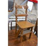 A late Victorian golden oak metamorphic library chair