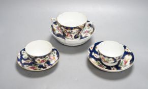 A Worcester scale blue chocolate cup and saucer and a pair of similar tea bowls and saucers, circa