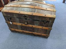 A Victorian leather bound dome top trunk, length 88cm, depth 50cm, height 60cm