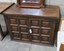 A Spanish panelled walnut two door cabinet, width 107cm, depth 54cm, height 70cm