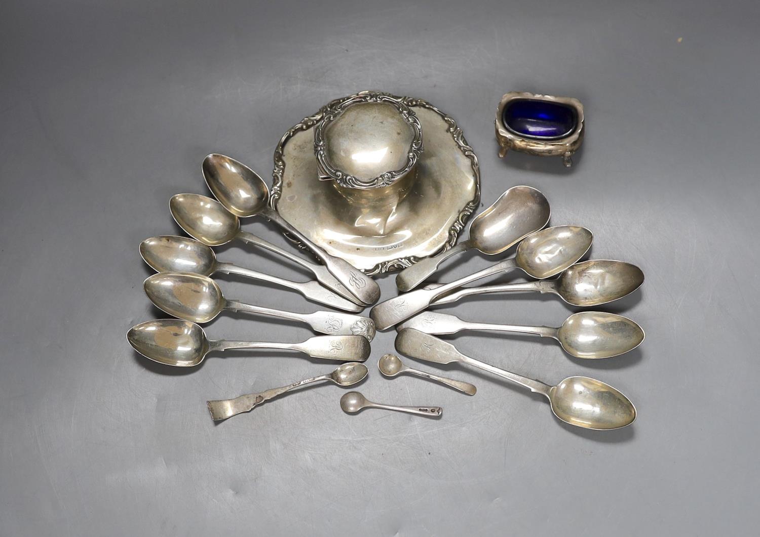 An early 20th century silver mounted inkwell, a silver salt and a small group of silver cutlery