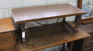 A Spanish style rectangular fruitwood low table, with wrought iron stretcher, length 107cm, depth