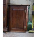 A George III oak hanging corner cabinet, width 83cm, depth 43cm, height 112cm