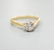 A modern 18ct gold and solitaire diamond ring, size N, gross weight 3.5 grams,the stone weighing