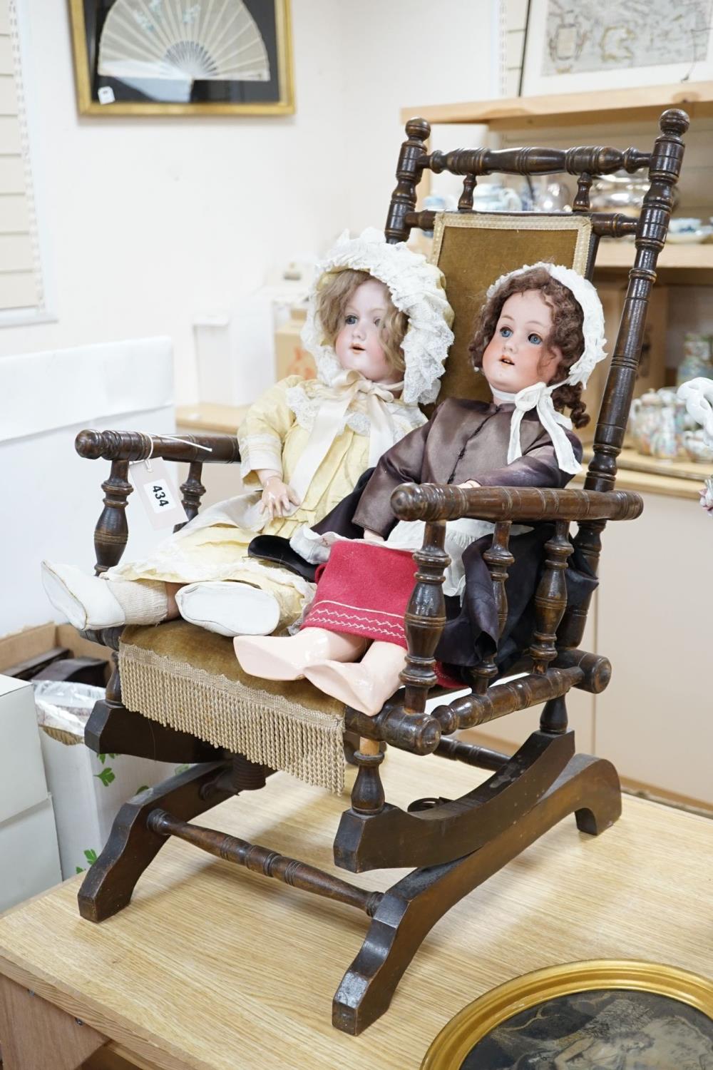 A Heubach, Koppelsdorf 250 bisque doll and an Armand Marseille 390 bisque doll, seated in turned - Image 2 of 5