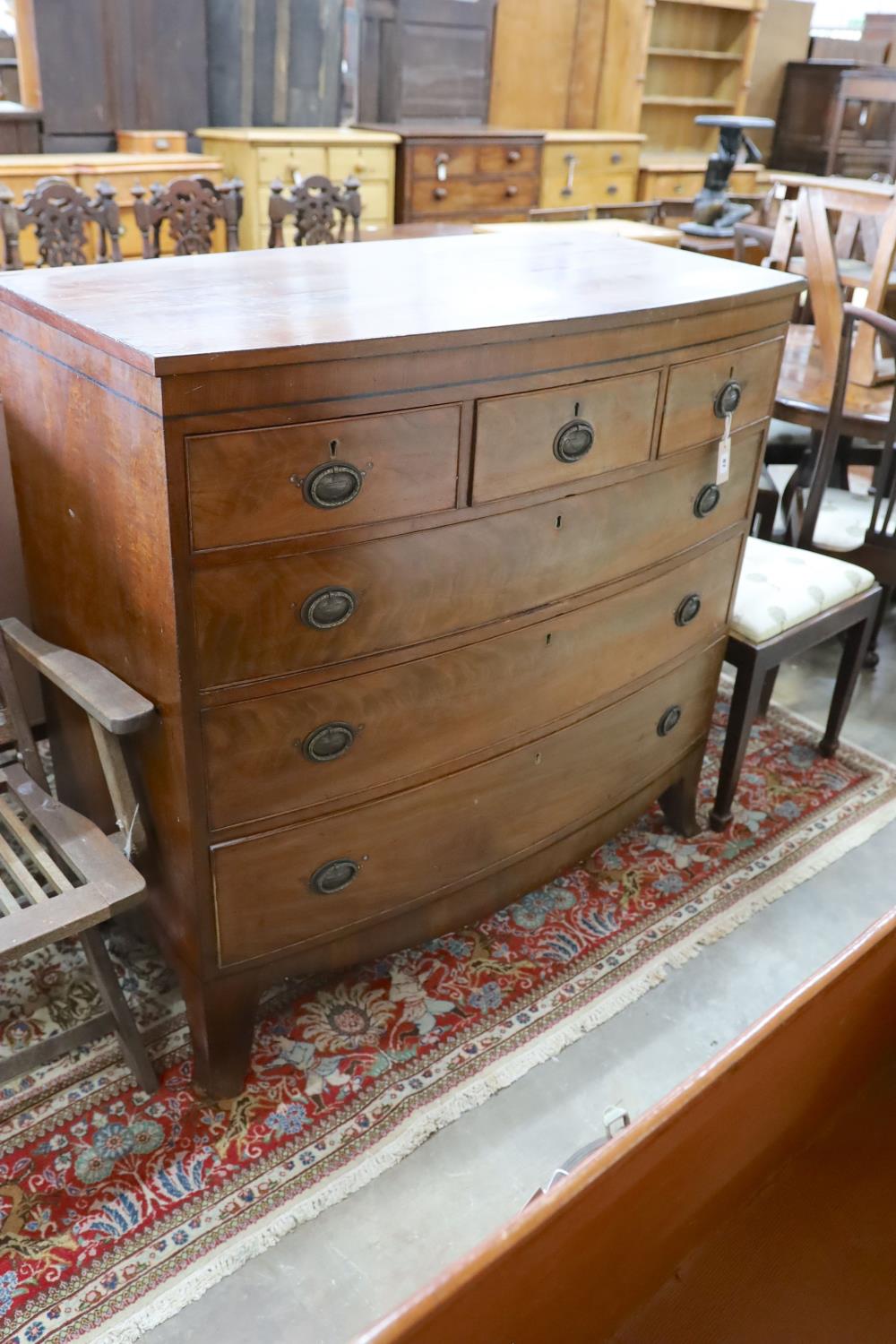 A Georgian mahogany bow fronted chest, fitted three short drawers and three long drawers on