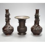 A pair of Japanese Meiji period bronze ‘dragon’ bottle vases and another, 21cm