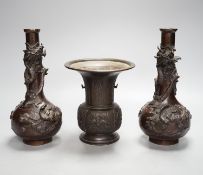 A pair of Japanese Meiji period bronze ‘dragon’ bottle vases and another, 21cm