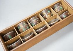 An early 20th century Chinese cased set of coconut cups with pewter liners