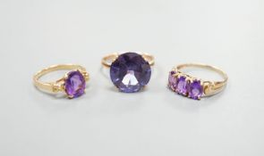 Two modern 14k yellow metal and gem set rings, including amethyst, size N, gross weight 7.4 grams