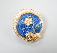 A nearly 20th century yellow metal, blue enamel and seed pearl set circular brooch, 22mm, gross 4.