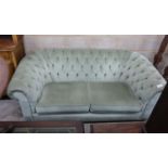 A Victorian style Chesterfield settee, upholstered in buttoned green dralon, width 204cm, depth