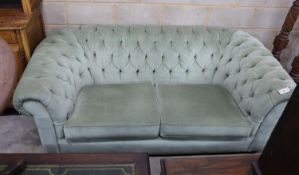 A Victorian style Chesterfield settee, upholstered in buttoned green dralon, width 204cm, depth