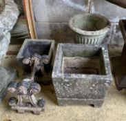 A Victorian cast iron boot scraper and three reconstituted stone garden urns, largest width 32cm,