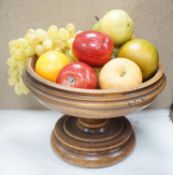 Faux fruit on a turned wood pedestal bowl