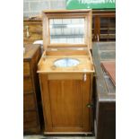 A late Victorian pitch pine wash stand with mirrored folding lid and blue and white printed basin (