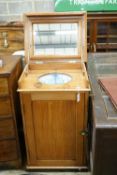 A late Victorian pitch pine wash stand with mirrored folding lid and blue and white printed basin (