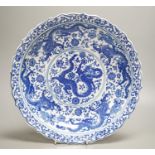 A Chinese blue and white ‘dragon’ dish 31cm