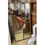 An industrial style aged metal framed wall mirror, width 67cm, height 146cm