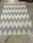 An Ikat contemporary dhurrie, approx. 200 x 160cm