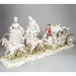 A large Italian porcelain carriage group and a pair of Italian white porcelain figure of a lady