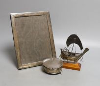 A George V silver mounted rectangular photograph frame, 24.2cm, a 1930's silver trinket box and a
